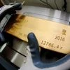 Gold hits 5-month low on strong dollar, Treasury yields