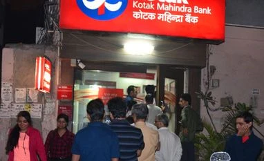 One week on: 25 deaths, chaos, never-ending bank queues and frustrated customers People withdrawing money from atms