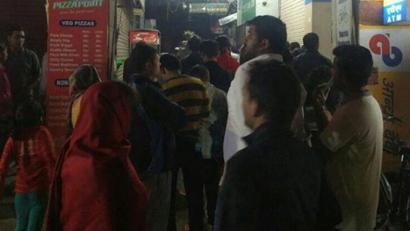 People withdrawing money from atms People withdrawing money from atms