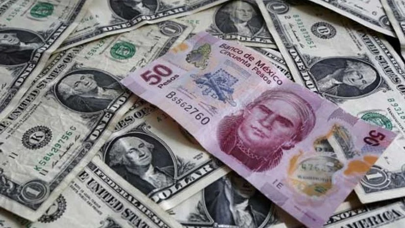 A picture illustration shows Mexican pesos and U.S. dollars banknotes in Mexico City (Reuters) A picture illustration shows Mexican pesos and U.S. dollars banknotes in Mexico City (Reuters)