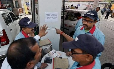 Going to currency exchanges with old notes? The taxmen are watching you People at a petrol pump to fill petrol as the Prime minister ordered to ban 500 and 1000 rupees notes as part of NDA Govt's fight against black money and corruption in New Delhi
