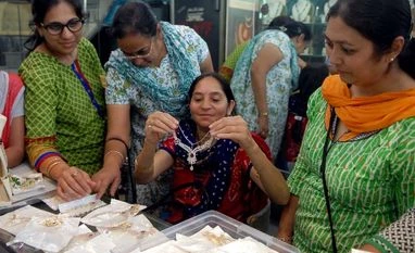 Gold regains Rs 31k-mark on renewed demand, silver tops Rs 45k People buying gold jewellery at a store in Mumbai (Pic: Kamlesh Pednekar)