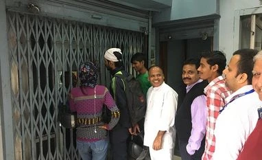 Post demonetisation, rural and semi-urban collections surpass expectations People wait for the bank to open