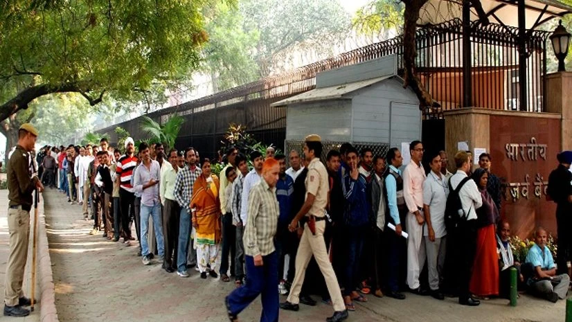 People standing in a long queue to exchange their old Rs 500 and Rs 1,000 notes outside the RBI building in New Delhi People standing in a long queue to exchange their old Rs 500 and Rs 1,000 notes outside the RBI building in New Delhi