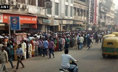 People in Kerala throng banks as ATMs run dry People wait to deposit and withdraw their money outside banks and ATMs (ANI)
