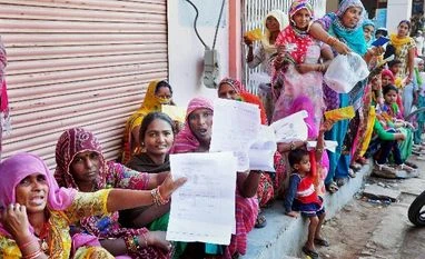 Post offices in Maharashtra, Goa amass scrapped notes worth Rs 435 cr Women queue up outside a bank to exchange their old Rs 1000 and 500 notes