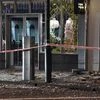 Glass and masonry litter the footpath in Wellington Monday, Nov. 14, 2016, after a major earthquake struck New Zealand's south Island