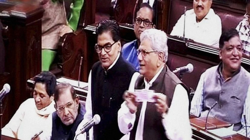 Samajwadi Party members Ramgopal Yadav speaks as CPI(M) leader Sitaram Yechury shows a Rs 2000 note in the Rajya Sabha on the opening of the winter session of Parliament in New Delhi Samajwadi Party members Ramgopal Yadav speaks as CPI(M) leader Sitaram Yechury shows a Rs 2000 note in the Rajya Sabha on the opening of the winter session of Parliament in New Delhi