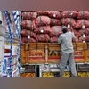 A labourer prepares to unload sacks of potatoes from a truck at a wholesale vegetable and fruit market in New Delhi A labourer prepares to unload sacks of potatoes from a truck at a wholesale vegetable and fruit market in New Delhi