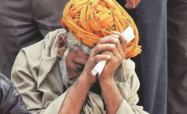 GDP growth to drop to 5.5% in FY17: govt sources A man sits in a queue to deposit his old high denomination banknotes in Ajmer photo: Reuters