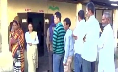 Live: 30% voters exercised their franchise till noon in Assam People queue up to vote for Lakhimpur Lok Sabha bypoll. (Photo: ANI)