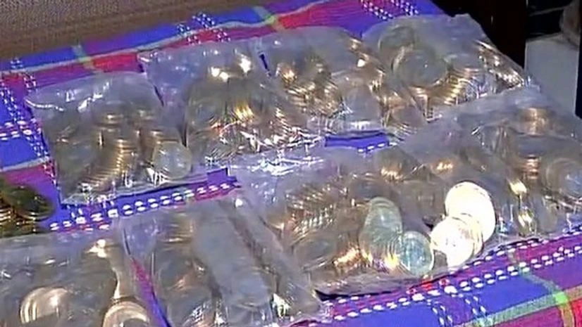 A man receives Rs 20,000 in the form of Rs 10 coins. (Photo: ANI) A man receives Rs 20,000 in the form of Rs 10 coins. (Photo: ANI)