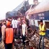 Rescue officials on the spot where 14 coaches of the Indore-Patna express derailed, killing around 90 people and injuring 150, in Kanpur Dehat