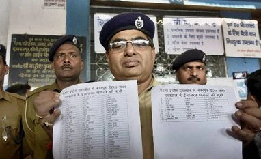 Kanpur train tragedy: MP CM announces Rs 2 lakh each for deceased victims A GRP officer showing casualty list of Indore-Patna express train which derailed near Kanpur