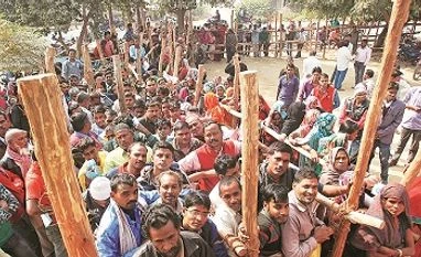 Cashless Cue: Villagers queue to exchange and deposit currencies outside a bank on the outskirts of Allahabad. If the demonetisation exercise is the first step in the long road to a cashless economy, then transferring amounts for the UBI will be an Cashless Cue: Villagers queue to exchange and deposit currencies outside a bank on the outskirts of Allahabad. If the demonetisation exercise is the first step in the long road to a cashless economy, then transferring amounts for the UBI will be an