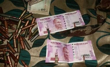 Rs 2,000 currency notes recovered from militants in J&K New Rs 2000 notes recovered from terrorists gunned down by Army in Bandipora. (Photo: Twitter/@ANI_news)