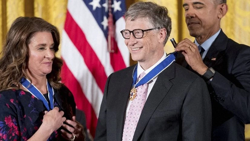 File photo of President Barack Obama, accompanied by Melinda Gates (left), presenting the Presidential Medal of Freedom to Bill Gates (centre). (Photo: PTI) File photo of President Barack Obama, accompanied by Melinda Gates (left), presenting the Presidential Medal of Freedom to Bill Gates (centre). (Photo: PTI)
