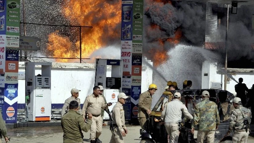 Fire fighters dousing a fire that broke out at a Dhanamanjuri College campus Imphal Fire fighters dousing a fire that broke out at a Dhanamanjuri College campus Imphal