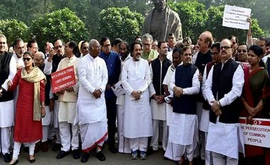 Govt reaches out to Oppn, indicates PM could intervene in demonetisation discussion Congress Vice president Rahul Gandhi with Opposition MPs during a protest outside Parliament against the government’s move to demonetise high tender notes