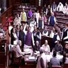 Opposition members protest in the Rajya Sabha in New Delhi. Photo: PTI