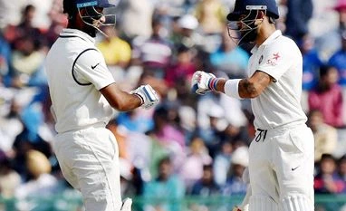 Indian Batsmen Virat Kohli and Cheteshwar Pujara at the 2nd day of 3rd India-England test match in Mohali. Indian Batsmen Virat Kohli and Cheteshwar Pujara at the 2nd day of 3rd India-England test match in Mohali.