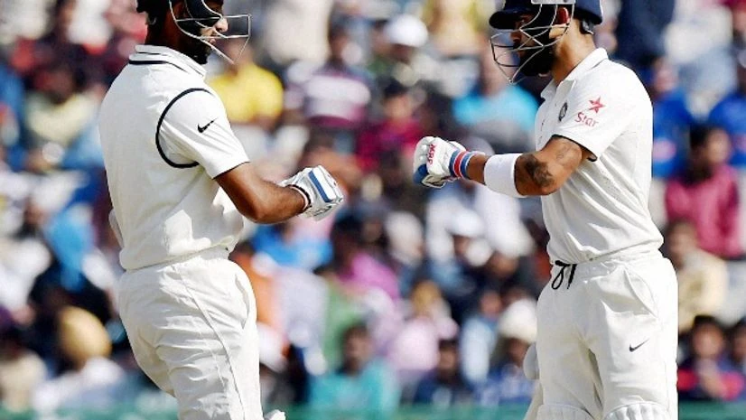 Indian Batsmen Virat Kohli and Cheteshwar Pujara at the 2nd day of 3rd India-England test match in Mohali. Indian Batsmen Virat Kohli and Cheteshwar Pujara at the 2nd day of 3rd India-England test match in Mohali.