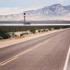 The Ivanpah Solar Electric Generating System sits in the desert in the Mojave Desert in California. A company has designed solar panels that can be laid into road surfaces and can withstand the weight of an 18-wheeler truck.	Bloomberg