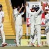 Indian players celebrate the wicket of Alastair Cook, who was dismissed by R Ashwin, on the third day of the third Test match between India and England, in Mohali on Monday (Photo: PTI)