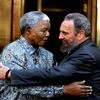 File photo: Former South African President Nelson Mandela and Cuban leader Fidel Castro embrace during a visit by Castro in Johannesburg in 2001