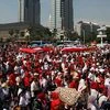 People take part in a rally against what they see as growing racial and religious intolerance in the world’s largest Muslim-majority country in Jakarta
