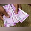 97.92% of Rs 2,000 banknotes returned; Rs 7,409 cr worth still with public A man counting Rs 2,000 notes. Photo: Shutterstock