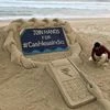 Sand sculpture with message to 'Join hands for Cashless India'