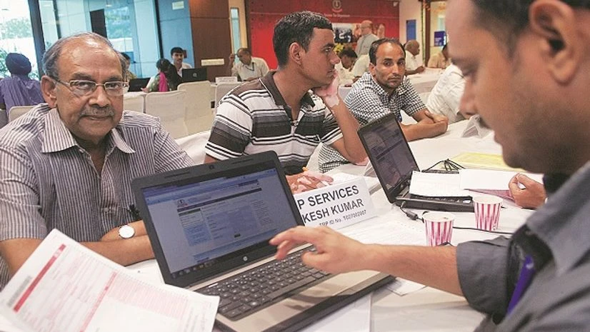 A file photo of people filing their income tax returns in New Delhi Demonetisation