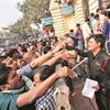 People queue up at a bank to exchange demonetised notes in New Delhi