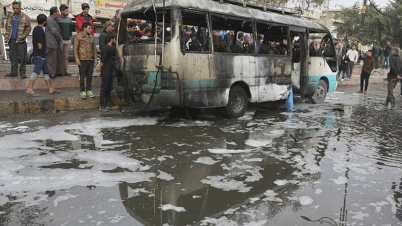 Citizens inspect the scene after a car bomb explosion at a crowded outdoor market in the Iraqi capital's eastern district of Sadr City, Iraq Citizens inspect the scene after a car bomb explosion at a crowded outdoor market in the Iraqi capital's eastern district of Sadr City, Iraq