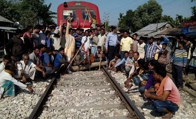 West Bengal plunges into chaos as TMC, BJP protest against each other TMC supporters stage a rail-roko protest in Cooch Behar, West Bengal, over arrest of TMC MP Sudip Bandyopadhyay