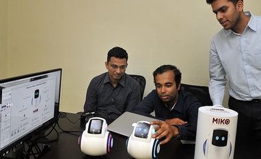 (Left to right) Prashant Iyengar, Sneh Vaswani and Chintan Raikar with the robot called Miko (Left to right) Prashant Iyengar, Sneh Vaswani and Chintan Raikar with the robot called Miko
