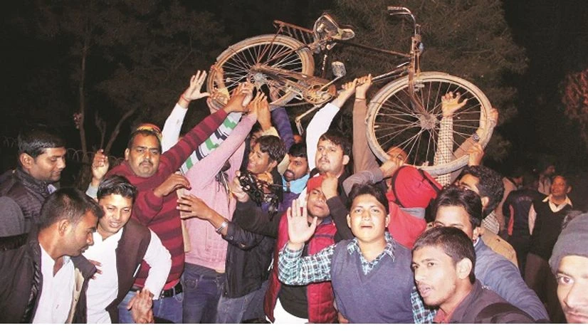Supporters celebrate in Allahabad after UP Chief Minister Akhilesh Yadav got the Samajwadi Party symbol, the cycle, and the party name Samajwadi Party, SP, Akhilesh Yadav, Akhilesh, Mulayam, Uttar Pradesh