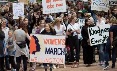 Women marching worldwide revive a long-sought dream: Global feminism Participants of a rally regarding women's rights hold placards as they march in Wellington, New Zealand