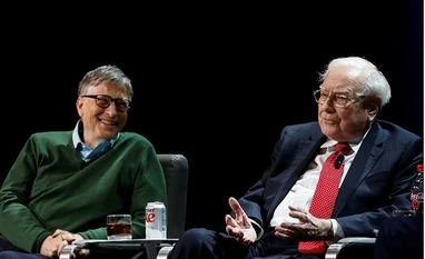 Buffett, Gates see hope in America under Trump Warren Buffett, chairman and CEO of Berkshire Hathaway, speaks while Bill Gates looks on at Columbia University in New York