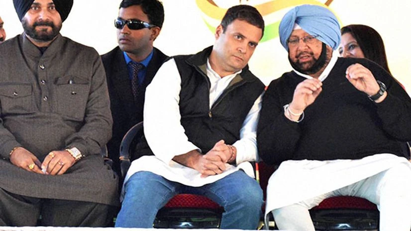 Congress Vice President Rahul Gandhi with party leaders Navjot Singh Sidhu and Captain Amarinder Singh during a rally in Majitha. Photo: PTI Congress Vice President Rahul Gandhi with party leaders Navjot Singh Sidhu and Captain Amarinder Singh during a rally in Majitha. Photo: PTI