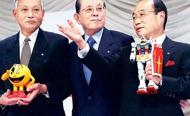 Masaya Nakamura, father of PAC-MAN dies at 91 Japan's toy maker Bandai President Takeo Takasu (right) poses with videogame company Namco Chairman Masaya Nakamura (centre) and Vice-Chairman Kyushiro Takagi in Tokyo