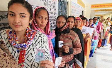 EC refutes Congress's claims, says didn't shift press meet for PM's rally Women voters wait in a long queue at a polling station to cast their votes for Punjab Assembly elections. Photo: PTI