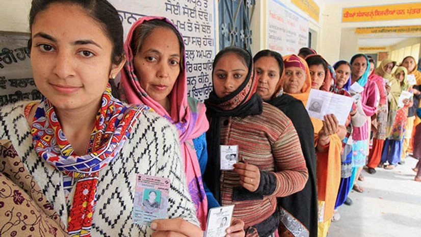 Women voters wait in a long queue at a polling station to cast their votes for Punjab Assembly elections. Photo: PTI Women voters wait in a long queue at a polling station to cast their votes for Punjab Assembly elections. Photo: PTI