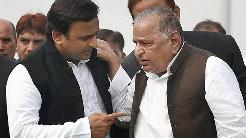 Uttar Pradesh Chief Minister Akhilesh Yadav with SP veteran Mulayam Singh Yadav. Photo: PTI Uttar Pradesh Chief Minister Akhilesh Yadav with SP veteran Mulayam Singh Yadav. Photo: PTI