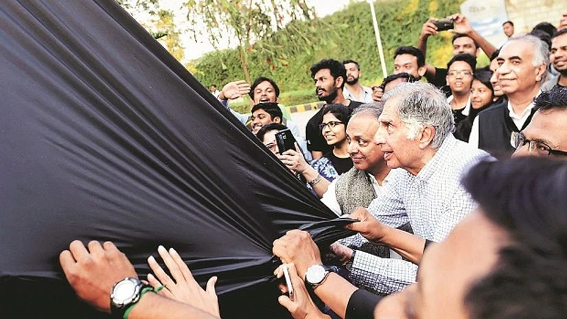 Tata Sons Interim Chairman Ratan Tata, with students unveils the Team Indus foundation's Moonshot Vehicle in Bengaluru on Tuesday. Photo: PTI Tata Sons Interim Chairman Ratan Tata, with students unveils the Team Indus foundation's Moonshot Vehicle in Bengaluru on Tuesday. Photo: PTI