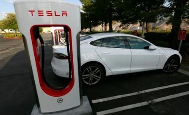 Tesla plans electric car factory in India A Tesla Model S charges at a Tesla Supercharger station in Cabazon, California. Photo: Reuters
