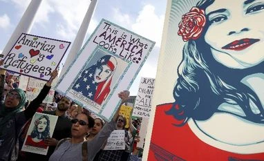 Trump's travel ban gets another blow; violates Constitution, says US Court File photo. Over 1,500 people rallied in a peaceful show of support for immigrants and refugees, protesting President Donald Trump's immigration policies