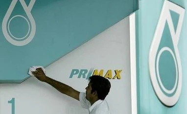 Malaysia's Petronas buys 25% stake in Shell-led LNG project Petroliam Nasional Bhd, petronas, Petronas logo, petrol kiosk, Kuala Lumpur