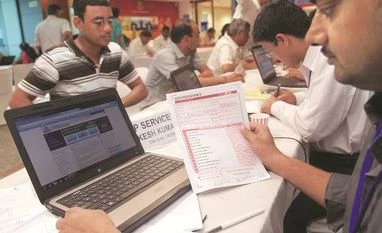 Firms must disclose securities transactions above Rs 10 lakh by May 31 People filing income returns at income tax office